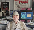 Father Fame at his desk.